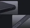 Close-up shots of a black phone case, highlighting its texture and branding. Produktbild-Vorschau
