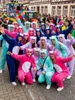A group of people in bear costumes at a carnival or parade. Produktbild-Vorschau