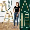 A woman stands next to a wooden ladder, with various dimensions and product shots displayed around them. Voir les images du produit