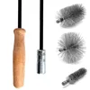 A set of chimney cleaning tools, including a wooden handle, a metal connector, and three different brush heads. Produktbild-Vorschau