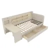 A beige upholstered daybed with a desk attachment and storage drawers. Anteprima dell’immagine prodotto