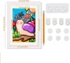 A white picture frame with a drawing of a snail inside, surrounded by flowers and leaves. Dimensions are shown in centimeters and inches. Accessories for hanging the frame are also displayed. Náhľad obrázku produktu