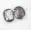 Two black ear pads are shown in a clear plastic bag against a white background. Produktbild-Vorschau