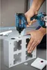 A person is using a Bosch drill to make a hole in a metal electrical box. Anteprima dell’immagine prodotto