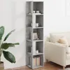 A tall, narrow bookshelf with a concrete-like finish is shown in a room next to a sofa and a large potted plant. Voir les images du produit