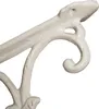 A close-up of a white decorative metal bracket. Náhľad obrázku produktu
