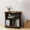 A wooden cabinet with shelves and books on a light-colored floor against a white wall. Anteprima dell’immagine prodotto