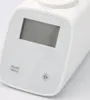 Close-up view of a white electronic thermostat head with a digital display and buttons. Produktbild-Vorschau