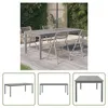A grey wooden dining table and chairs set in an outdoor garden setting. Podgląd zdjęcia produktu