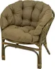 A close-up studio shot of a brown rattan chair with a thick, tufted cushion. Produktbild-Vorschau
