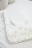 A white electric blanket with a dandelion pattern is laid out on a bed. Anteprima dell’immagine prodotto
