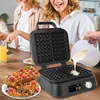 Two women are in a kitchen, one pouring batter into a waffle maker while the other smiles. A stack of waffles is on a plate in the foreground. Náhľad obrázku produktu