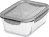 A clear, studio shot of a rectangular glass food storage container with a gray lid. Voir les images du produit