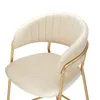 A close-up view of a beige upholstered chair with gold metal legs. Produktbild-Vorschau