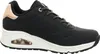 A side view of a black Skechers sneaker with a white sole and rose gold accents. Náhled obrázku produktu
