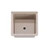 A top-down view of a beige sink with a drain in the center. Anteprima dell’immagine prodotto