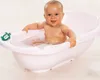 A baby is sitting in a pink bathtub with a turtle-shaped thermometer. Anteprima dell’immagine prodotto