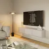 A modern living room with a couch, coffee table, and a wall-mounted TV board. Voir les images du produit