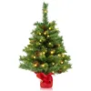 A small, pre-lit artificial Christmas tree decorated with pine cones and a red bow at its base, set against a white background. Anteprima dell’immagine prodotto
