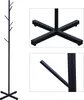 A black metal coat rack with a tree-like design and multiple hooks, shown against a white background. Insets show a close-up of the base and a hook. Voir les images du produit