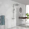 A modern bathroom with a chrome shower set against white brick tiles. Produktbild-Vorschau