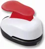 A close-up studio shot of a small, red and white hole puncher. Produktbild-Vorschau