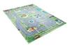 A colorful children's play rug depicting a town with roads, buildings, and a carousel. Produktbild-Vorschau