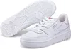 A pair of white Fila sneakers shown from a slightly elevated side angle, with one shoe in the foreground and the sole of the other shoe visible in the background. Produktbild-Vorschau