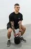 A man is performing a kettlebell exercise. Produktbild-Vorschau