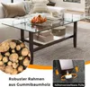 A coffee table with a glass top and wooden frame, decorated with oranges and boxes, placed on a rug in a living room setting. A close-up inset shows logs, and another inset shows adjustable feet. Anteprima dell’immagine prodotto