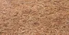 A close-up, textured view of a brown, fibrous material, likely a mattress or bedding. Produktbild-Vorschau