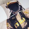 A close-up view of a comforter and pillowcase with a firefighter design. Produktbild-Vorschau