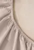 A close-up view of the elasticized edge of a fitted sheet. Produktbild-Vorschau