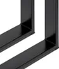 A close-up view of two black metal table legs, showing the welded joints and the base of the legs. Produktbild-Vorschau