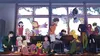 A group of anime characters and their Digimon partners are gathered in a classroom setting. Produktbild-Vorschau