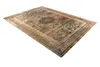 A rectangular rug with a detailed pattern is shown from a slightly elevated angle against a white background. Voir les images du produit