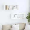 Two white cube shelves mounted on a white wall above a beige sofa. Náhľad obrázku produktu