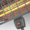 A close-up view of an infrared heater with glowing heating elements visible through a protective grille. A power switch is also visible. Produktbild-Vorschau
