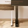 A close-up of two desk legs, one white and one black, with a wooden desktop. Text overlays indicate features like "Reinforced table legs" and "Unwavering stability". Podgląd zdjęcia produktu