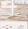 Close-up of a white table leg and base with measurement labels, and diagrams below showing the base structure and adjustability. Produktbild-Vorschau