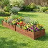 A raised garden bed filled with colorful flowers and greenery, set in a well-maintained backyard with a wooden fence in the background. Voir les images du produit