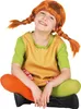 A child dressed as Pippi Longstocking, sitting cross-legged. Produktbild-Vorschau
