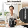 A woman is holding a black electric kettle in a kitchen setting, with text overlays highlighting product features. Produktbild-Vorschau