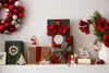 A collection of Christmas gifts and decorations arranged on a shelf. Podgląd zdjęcia produktu
