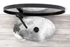 A top-down view of a sink with a faucet, placed on a wooden surface. Náhled obrázku produktu