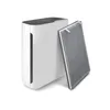 A white air purifier with a gray filter next to it, on a white background. Produktbild-Vorschau
