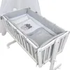 A baby crib set with bedding. Produktbild-Vorschau