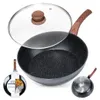 A black granite wok with a wooden handle and a glass lid, shown with a product label and a view of the pan's underside. Náhled obrázku produktu