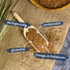 A wooden scoop filled with flax seeds on a burlap cloth, with text labels highlighting product features. Produktbild-Vorschau