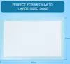 A product image showing a large white and light blue dog training pad with dimensions indicated. Produktbild-Vorschau